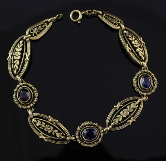 An early 20th century French 18ct gold and synthetic sapphire bracelet, 7.25in.